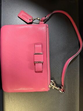 Coach Darcy Bow Strawberry Pink Saffiano leather wristlet.